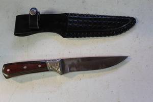 lot 63 image: knife and its matching sheath