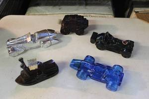 lot 75 image: collection of vintage Avon glass cologne and aftershave bottles designed in the shapes of various vehicles