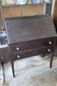 lot 92 image: antique slant front Secretary desk with a drop-front writing surface. And two drawers for storage