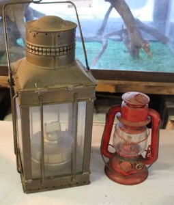lot 97 image: vintage brass nautical lantern, likely a ships cargo or anchor light and vintage red Dietz kerosene lantern