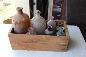 lot 112 image: collection of vintage or antique glass bottles housed in a wooden crate