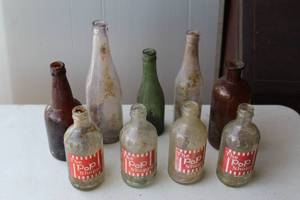 lot 115 image: collection of vintage The Pop Shoppe glass soda bottles. And others see pictures