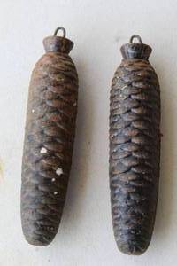 lot 140 image: vintage cast iron pine cone-shaped weights,