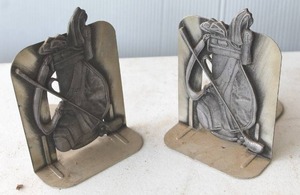 lot 189 image: bookends feature a detailed golf bag design.