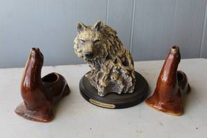 lot 193 image: Wellington Collection Wolf Head Figurine. 2-vintage ceramic novelty planter or ashtray shaped like a sea lion or seal, featuring a brown glazed finish.