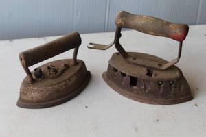 lot 197 image: antique sad irons, which are heavy, solid cast iron tools used for pressing clothes