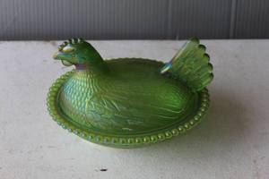 lot 204 image: vintage Indiana Glass company Hen on Nest covered candy dish made of iridescent green carnival glass.