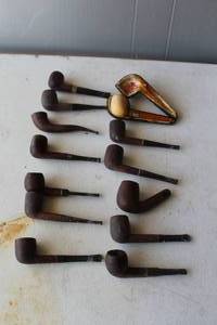 lot 209 image: collection of vintage tobacco smoking pipes, featuring various classic shapes and styles including billiard, bent, and poker designs.