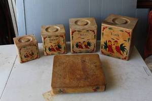 lot 230 image: vintage 1960s wooden four-piece nesting canister set featuring a country rooster design. And matching cutting board