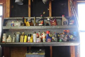 lot 237 image: Shelf and all of the collection of automotive fluids and maintenance chemicals (bring tools to remove your self)