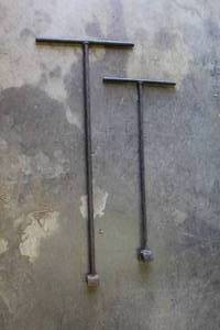 lot 268 image: manhole cover hooks or utility keys, often used for lifting drain grates or operating water meter cut-off valves.