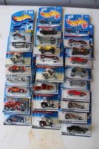 lot 276 image: collection of vintage Hot Wheels die-cast toy cars still in their original packaging. From 2000 and lower and some may have damage to package