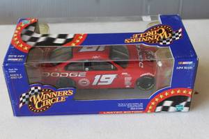 lot 301 image: Signed 124 scale die-cast NASCAR collectible car featuring the #19 Dodge Intrepid driven by Casey Atwood,