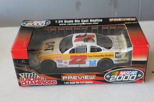 lot 302 image: Signed 2000 Racing Champions Premier Series 124 scale die-cast replica of Ward Burtons #22 Caterpillar stock car.
