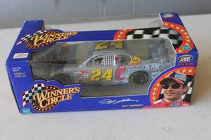 lot 303 image: Signed 2000 Winners Circle Jeff Gordon #24 DuPont Monte Carlo 124 scale NASCAR diecast car.