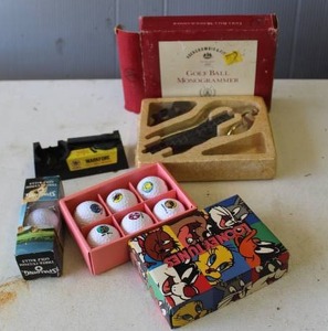 lot 316 image: vintage Abercrombie & Fitch Golf Ball Monogrammer used for personalizing golf balls with initials and  Looney Tunes themed golf ball set and more see pictures for details