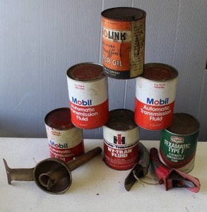 lot 342 image: collection of vintage oil and transmission fluid cans, most full and vintage oil lube self-piercing can opener and funnel
