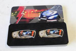 lot 357 image: collectible set of two folding pocket knives themed after the Hot Wheels NASCAR racer Rockin Racer featuring the number 2