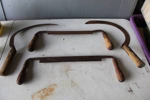 lot 494 image: vintage drawknives, also known as draw shaves, are traditional woodworking tools used for shaping wood by removing shavings and 2-vintage sickles or grasshooks, commonly used as antique hand tools for harvesting grain or cutting weeds.