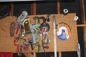 lot 498 image: All assortment of tools hanging on a pegboard. Pegboard not included