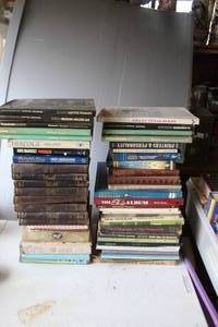lot 437 image: Stack of books  been locked away for years see pictures for titles