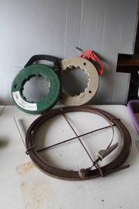 lot 438 image: Greenlee 438-10 Steel Fish Tape designed for pulling wires through conduit. And a flat sewer rod and more see pictures for details