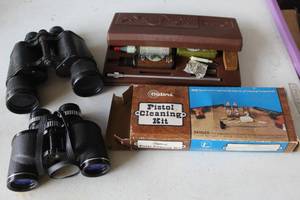 lot 449 image: Pistol cleaning kit and vintage Herters 7x35 zoom binoculars and a pair of Bushnell 7x50 binoculars.