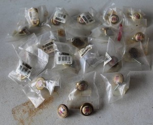 lot 516 image: vintage brass cabinet knobs feature a decorative floral pattern