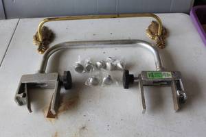 lot 535 image: Cabinet knobs and safety bar and towel rack