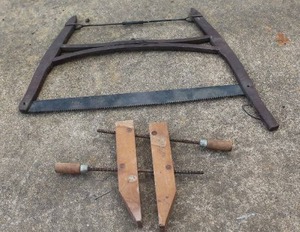 lot 540 image: antique buck saw,  And vintage Jorgensen wooden handscrew clamp