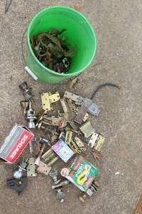 lot 548 image: Bucket full  of vintage hardware and locks, including various brass hinges, door knobs, and more see pictures for details