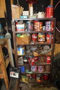 lot 554 image: shelving unit packed with vintage collectibles, primarily old coffee cans and various household items. Took pictures of a lot see pictures
