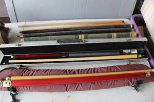 lot 556 image: Collection of pool sticks