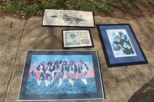 lot 560 image: collection of framed memorabilia with  A vintage poster or photograph signed by the Dallas Cowboy Cheerleaders,dated 89 and more see pictures for details