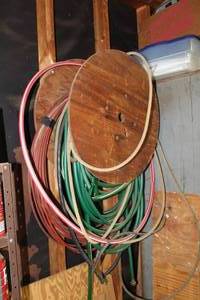 lot 562 image: electrical wire cable and hose on wood spool and rope