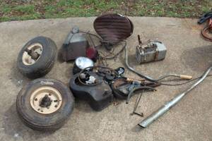 lot 563 image: vintage Cushman wheels and variety of parts