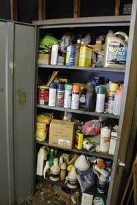 lot 569 image: metal storage cabinet with all tools, chemicals, and supplies.
