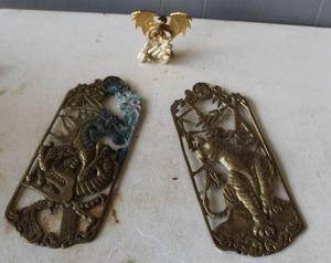 lot 580 image: Franklin Mint Eye of the Golden Dragon pocket watch stand designed by artist Michael Whelan.  And vintage Asian-style brass wall plaque featuring a sculpted dragon,and  tiger standing amidst bamboo.