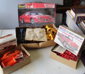 lot 617 image: Model cars Revell 116 scale 1987 Camaro IROC Z-28 plastic model kit. And Monogram 69 Street Camaro 124 scale plastic model kit. And Monogram 1957 Chevy Hardtop 124 model kit,