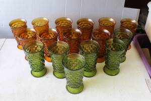 lot 632 image: collection of vintage Indiana Glass Whitehall Cubist footed tumblers in green and amber colors.