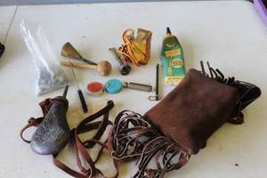 lot 652 image: This collection consists of vintage muzzleloading shooting accessories and a possible replica caplock kit