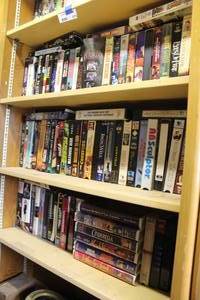 lot 670 image: 3 shelfs of VHSS see pictures for titles been locked away for years