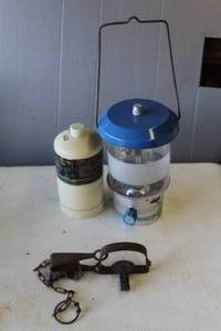 lot 705 image: portable propane camping lantern and vintage animal trap,