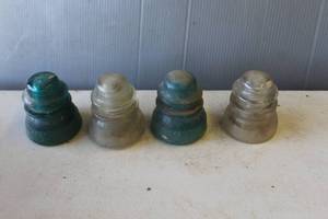lot 762 image: Antique Hemingray Glass Company telephone line insulators