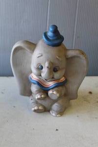 lot 764 image: vintage Dumbo elephant figurine, likely produced by Walt Disney Productions stamped on the back