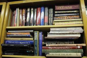 lot 777 image: 2-shelfs of books thats been locked away for years see pictures for titles