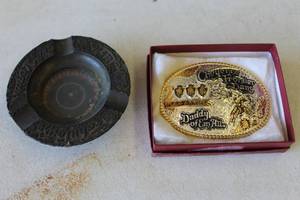 lot 822 image: vintage Fabulous Las Vegas themed ashtray featuring an integrated, working roulette wheel.  About 5 inches & 2000 Cheyenne Frontier Days Rodeo Gold Tone GIST Trophy Belt Buckle