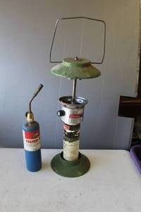 lot 830 image: propane torch,& vintage Coleman Model 5114 dual-mantle propane camping lantern. With no glass