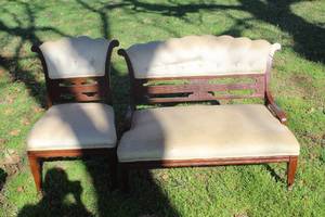 lot 868 image: wooden settee and a matching chair with cream-colored upholstery.  Needs to be cleaned