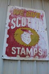 lot 892 image: vintage-style advertising sign featuring the We Give Scott Stamps logo, 4 foot tall